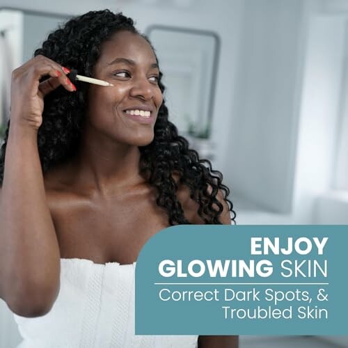 Woman applying skincare product for glowing skin